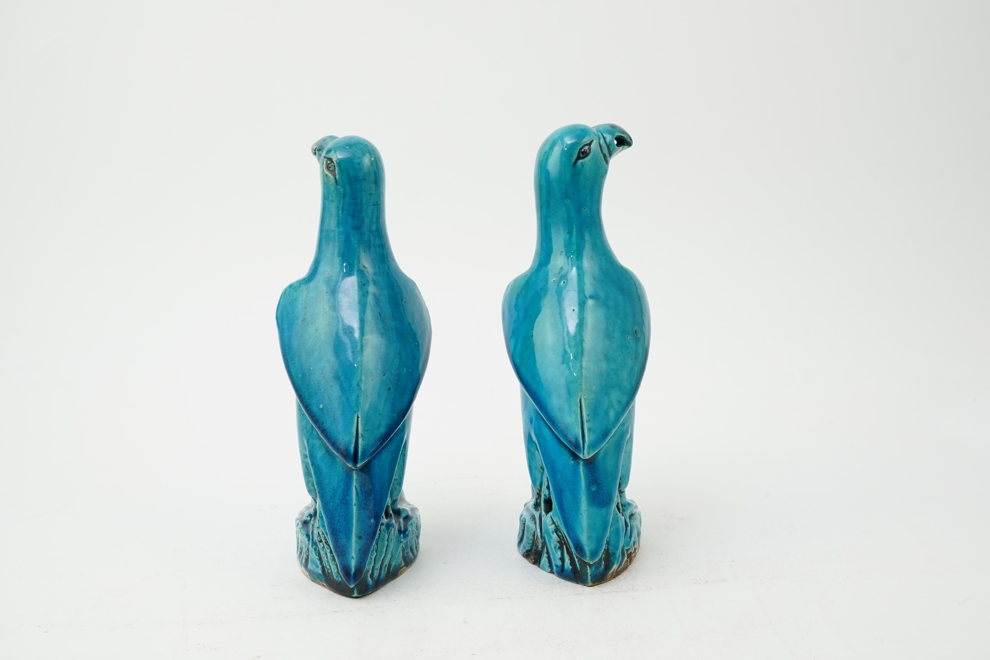 A pair of Chinese turquoise glazed models of parrots, 18th century